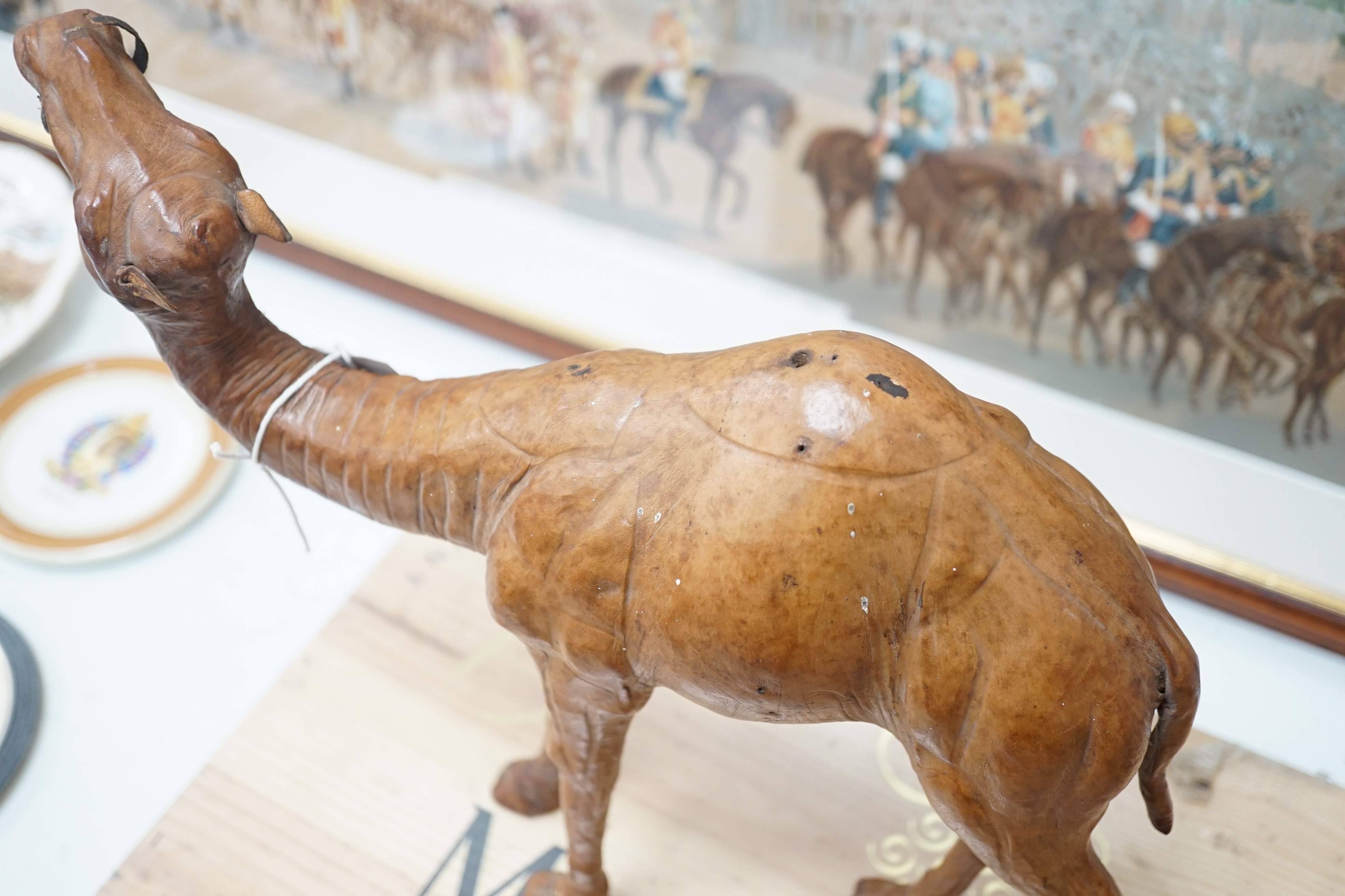 A leather covered model of a camel 32cm long